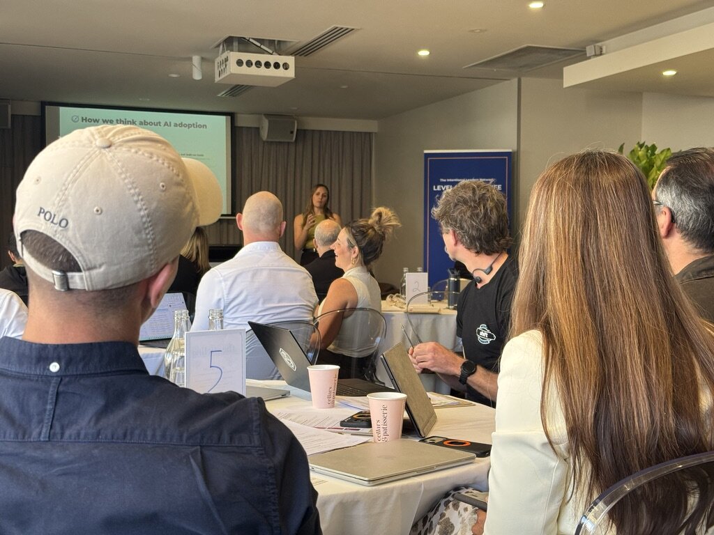 A speaker presenting to the room at a Grow event