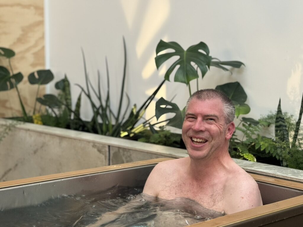 An operator in the cold plunge at Nourish